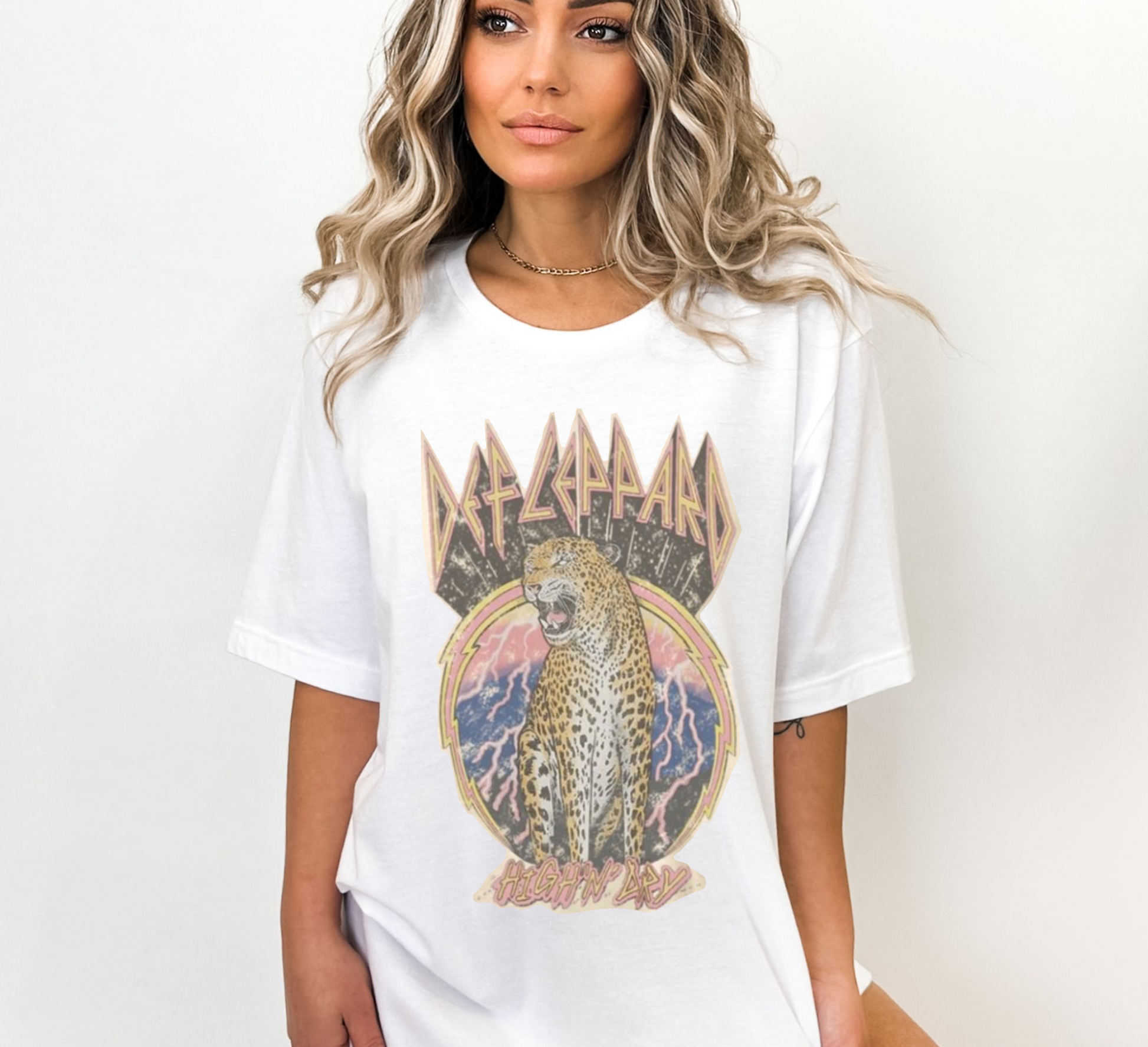 Person wearing a white t-shirt with a graphic design of a leopard and text.